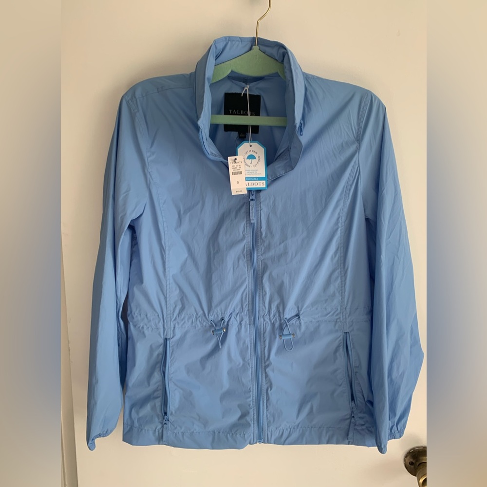 Water resistant lightweight rain jacked with hidden hood